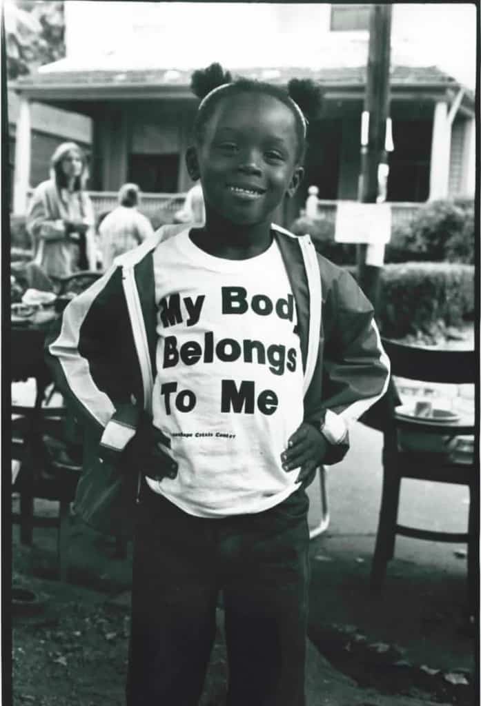 A child in a "My Body Belongs to Me" t-shirt